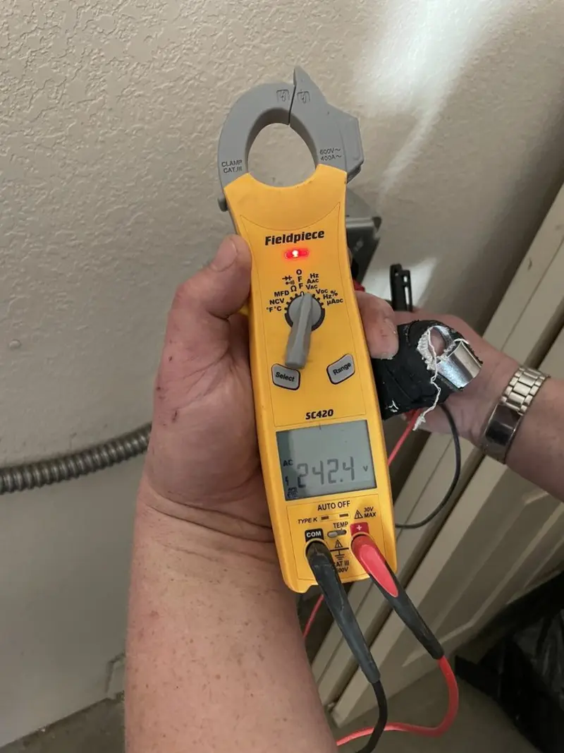 Voltage testing with clamp meter during Ceiling Fan Installation in Samsula-Spruce Creek
